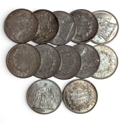 an image of a bunch of coins sitting on top of a white surface