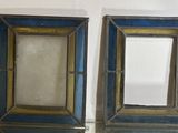 two mirrors that are on the wall next to each other