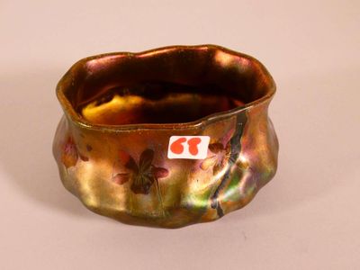 a close up of a vase with a tag on it