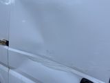 a white van that is parked on the side of the road