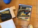 a box full of toy trains on a wooden floor