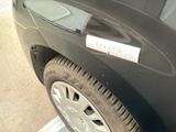 a black car with a sticker on the side of it