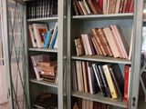 many books that are on the shelves in the room