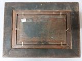 a picture of an old wooden picture frame on the wall