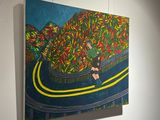 painting hanging on the wall of a room with a painting of a person on a motorcycle
