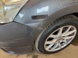 a close up of a car that has a denting on it