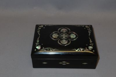 an image of a black and gold box on a white background