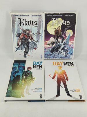 three books on a white table with a white background