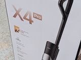 box of a vacuum cleaner sitting on the floor next to the box