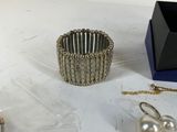 a table that has a bunch of jewelry on it