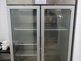 two glass doors that are open in a kitchen