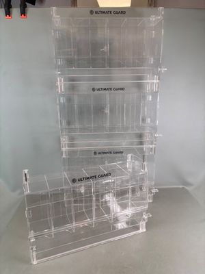 three clear acrylic display cases stacked on top of each other