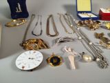 many different types of jewelry sitting on a table
