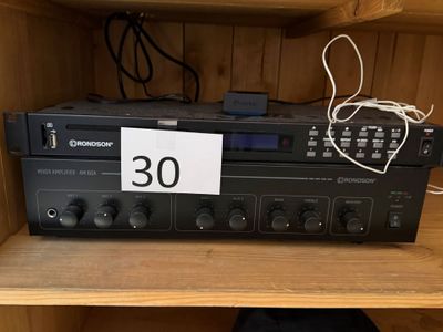 a close up of a radio sitting on top of a wooden shelf