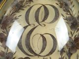 a picture of a decorative plate with the number eight on it