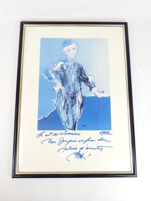 framed photograph of a woman in a blue dress holding a tennis racquet