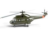 a green helicopter that is sitting on a white surface