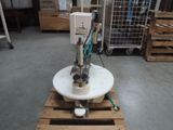 a machine that is sitting on a pallet in a warehouse