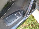 a close up of a car door with a remote control
