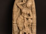 a statue of a woman holding a child in her arms