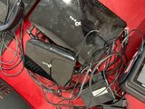 a lot of electronics that are on a red table
