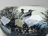 a vase with a painting of two birds on it