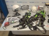 a table with various items on it including a helmet, goggles and other items