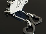 a pair of handcuffs with a tag attached to them
