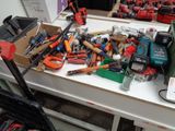 a table with many tools on it in a room