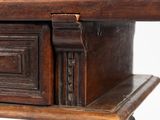 a wooden table with a drawer on top of it