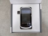 a cell phone that is in a box on a table
