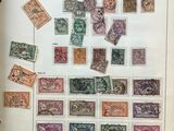 an open book with a bunch of different stamps on it