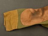 an image of a pair of gloves on a black surface