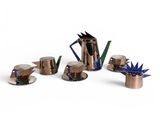 an image of a group of metal objects sitting on top of a white surface