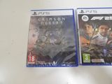 two video games are sitting on a table next to each other