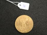 an image of a gold coin with a price tag on it
