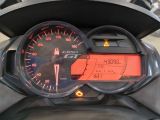 a speedometer on the dashboard of a scooter