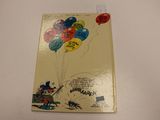 a card with a picture of a man holding a bunch of balloons