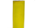 a yellow vase that is sitting on a white surface