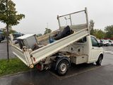 a white truck that is parked on the side of the road