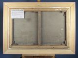 an old picture of a painting on a easel with a sign in front of it