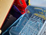 a pile of plastic containers and crates stacked on top of each other