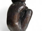 sculpture of a woman ' s hand holding a child ' s hand