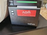 a printer sitting on top of a box on a table
