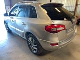 a silver car that is parked in a garage