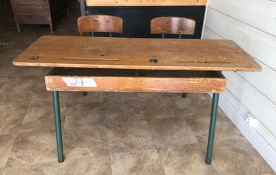 a wooden desk with two wooden chairs in front of it
