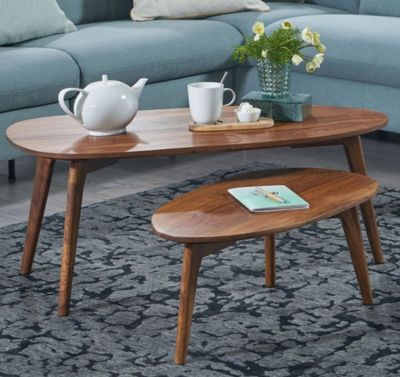 a blue couch and a coffee table in a living room