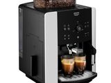 a coffee machine with two cups of coffee in front of it