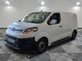 the white van is parked on a checkered floor in a room