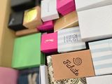 a box full of notepads and other office supplies